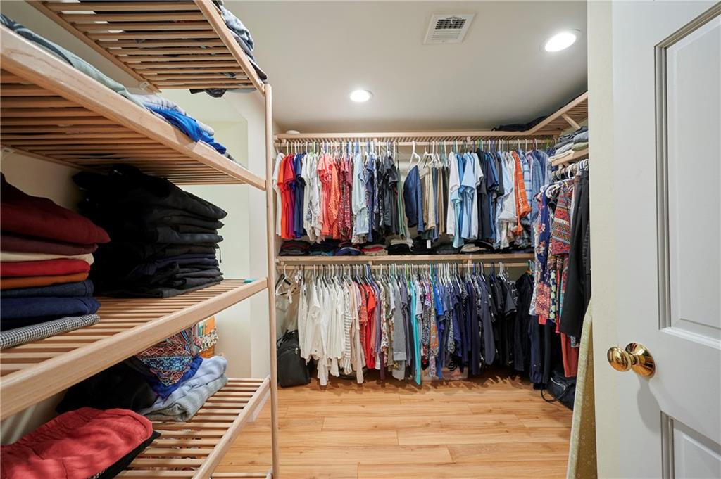 1565 48th Avenue Vero Beach, FL 32966 - Photo 29 of 34 a view of walk in closet with clothes