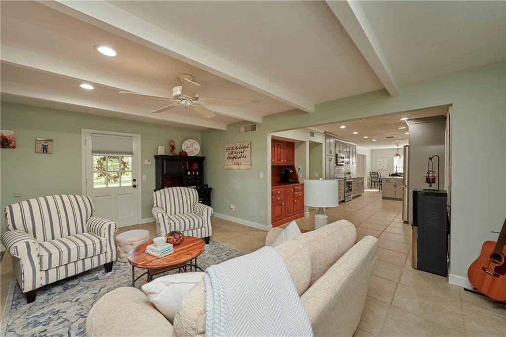 1565 48th Avenue Vero Beach, FL 32966 - Photo 10 of 34 a living room with furniture and a wooden floor