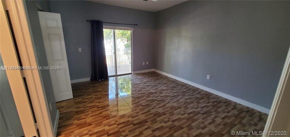 3544 Northeast 3rd Drive Homestead, FL 33033 - Photo 13 of 25 a view of a hallway with wooden floor and stairs