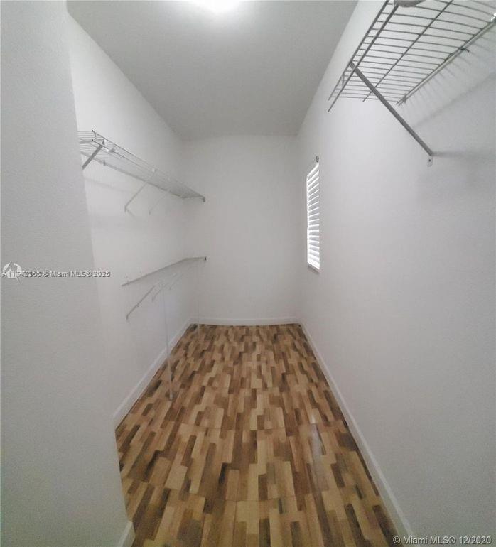 3544 Northeast 3rd Drive Homestead, FL 33033 - Photo 14 of 25 a view of a room with racks on the wall