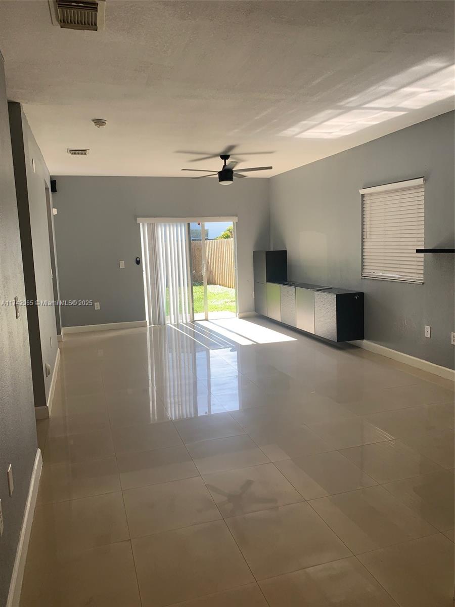 3544 Northeast 3rd Drive Homestead, FL 33033 - Photo 19 of 25 a view of a hallway with a kitchen