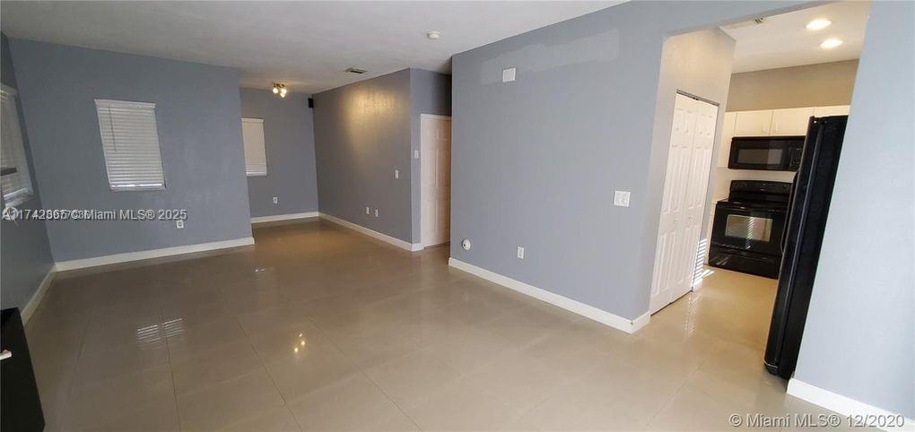 3544 Northeast 3rd Drive Homestead, FL 33033 - Photo 5 of 25 an empty room with closet and wooden floor