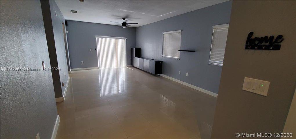 3544 Northeast 3rd Drive Homestead, FL 33033 - Photo 6 of 25 a view of a hallway to a bedroom