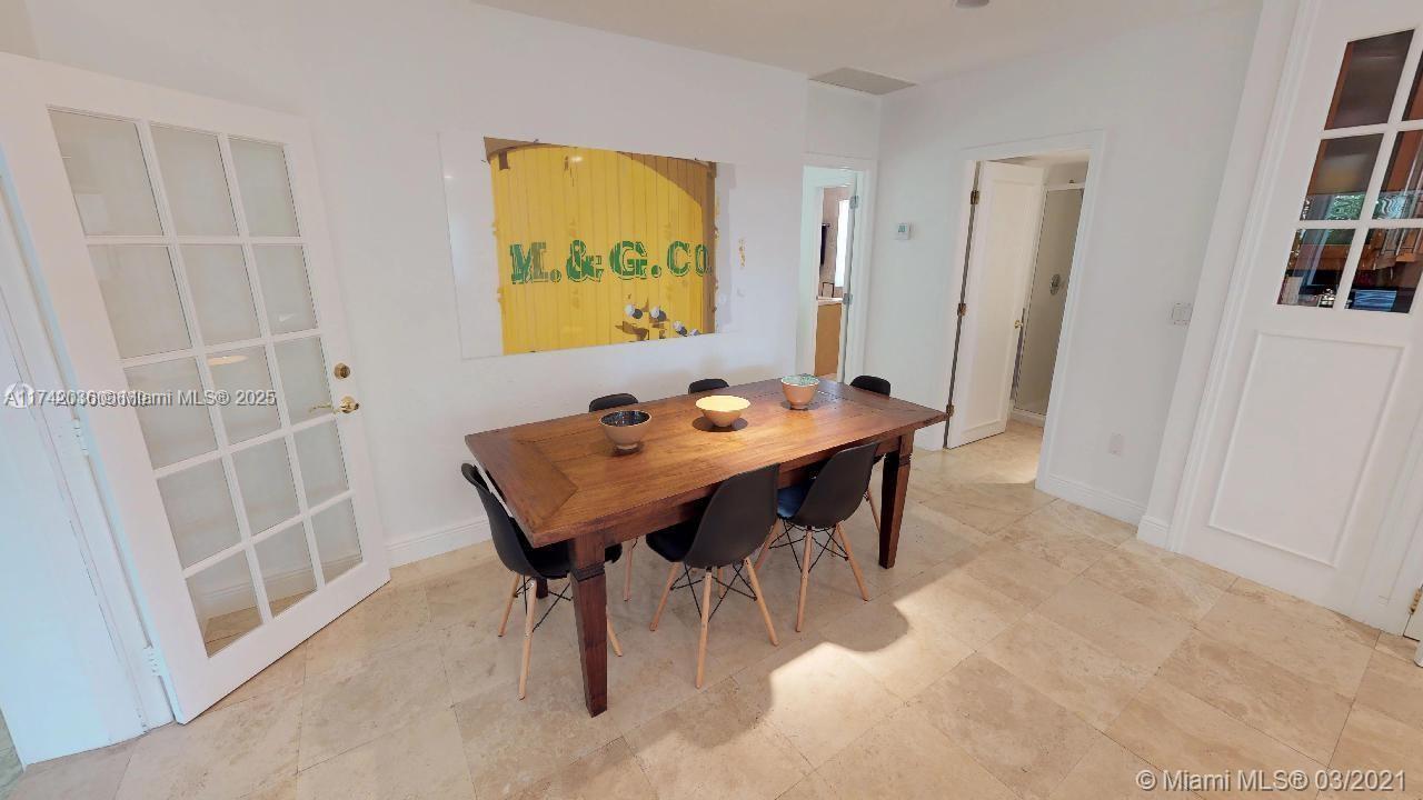 310 Glenridge Road Key Biscayne, FL 33149 - Photo 5 of 18 a view of a dining room with furniture and window