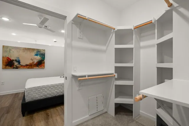 a bedroom with a bed and a couch