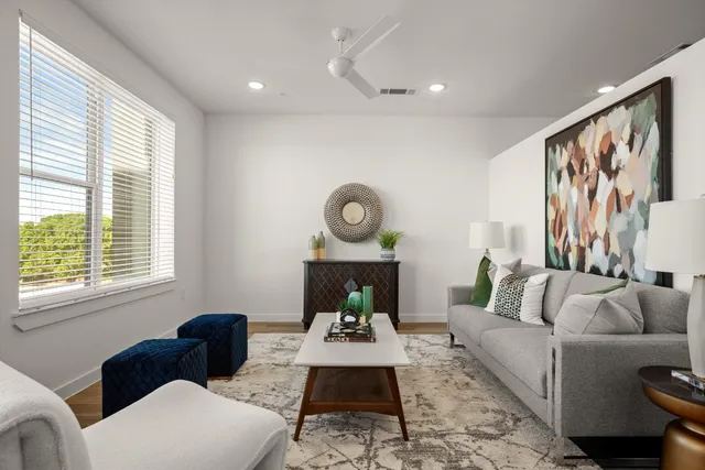 a living room with furniture and a large window