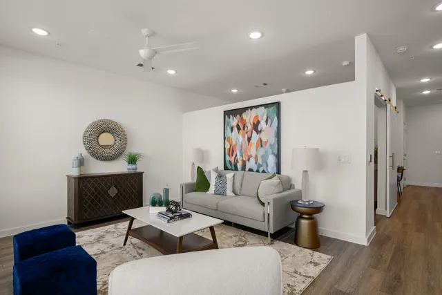 a living room with furniture and a fireplace