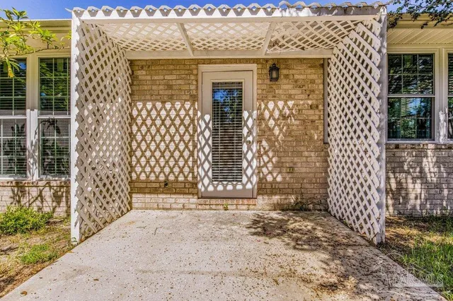 a front view of a house with a large window