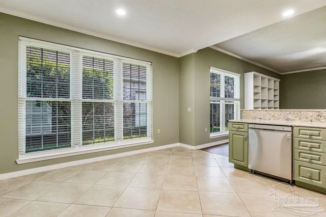 a view of kitchen with windows and cabinet