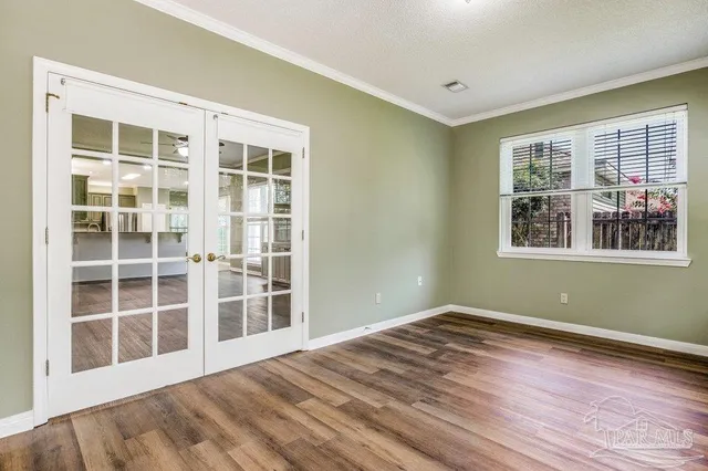 a view of empty room with windows