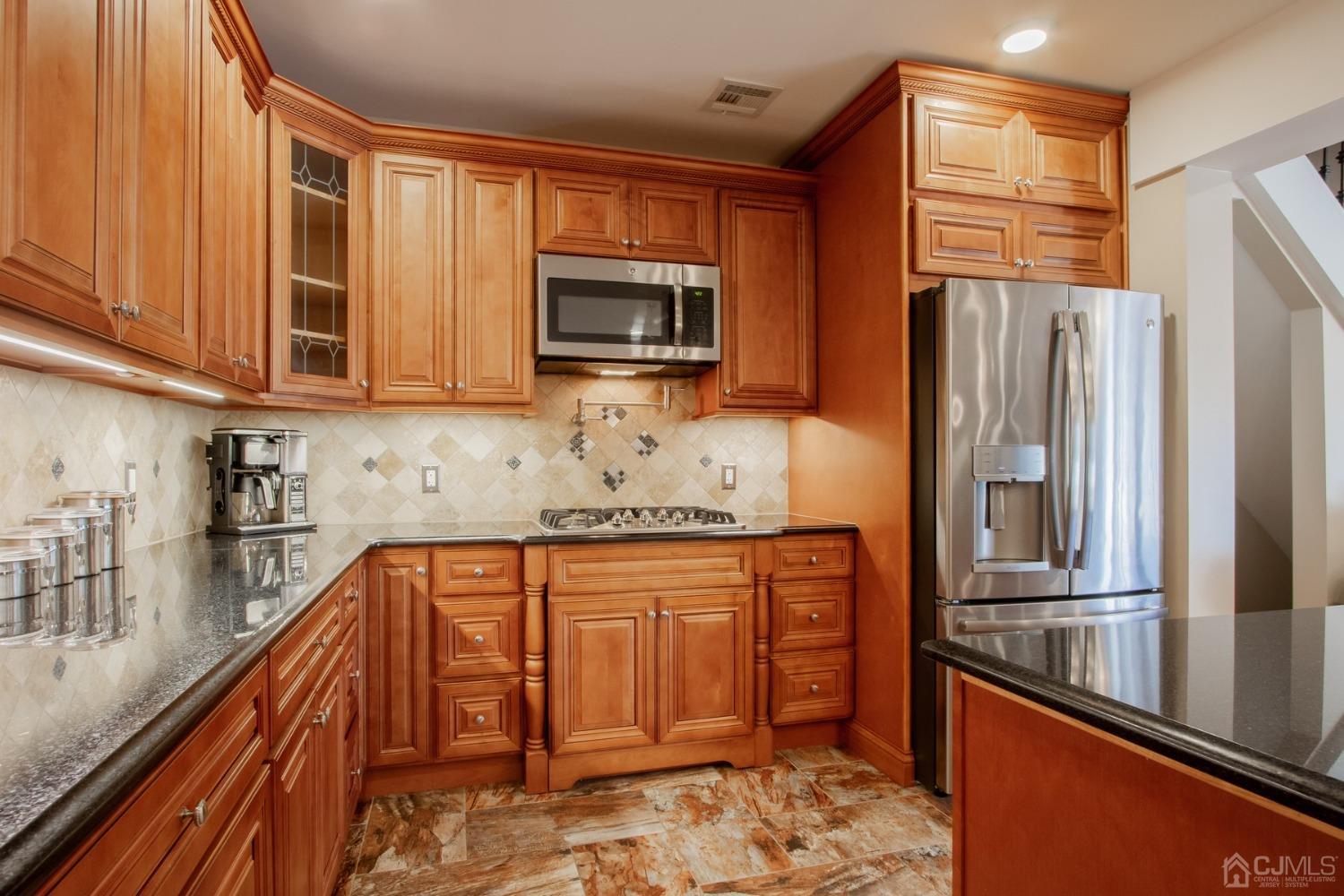 80 Princeton Road Old Bridge, NJ 08859 - Photo 12 of 40 a kitchen with stainless steel appliances granite countertop a refrigerator and a stove top oven