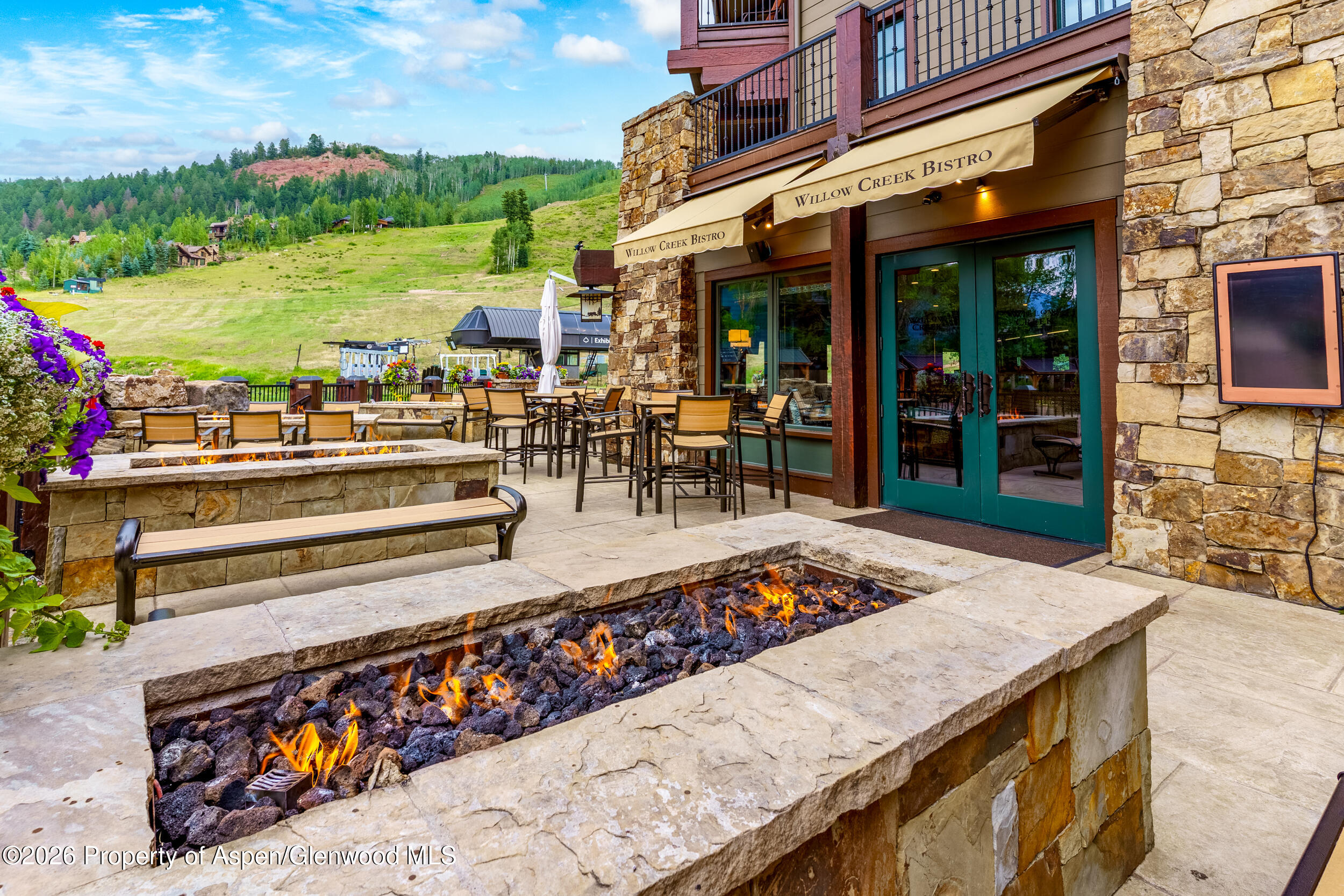 39 Boomerang Road, Unit 8210/WINTER INTEREST 3 Aspen, CO 81611 - Photo 27 of 44 a view of a chairs and table in the patio