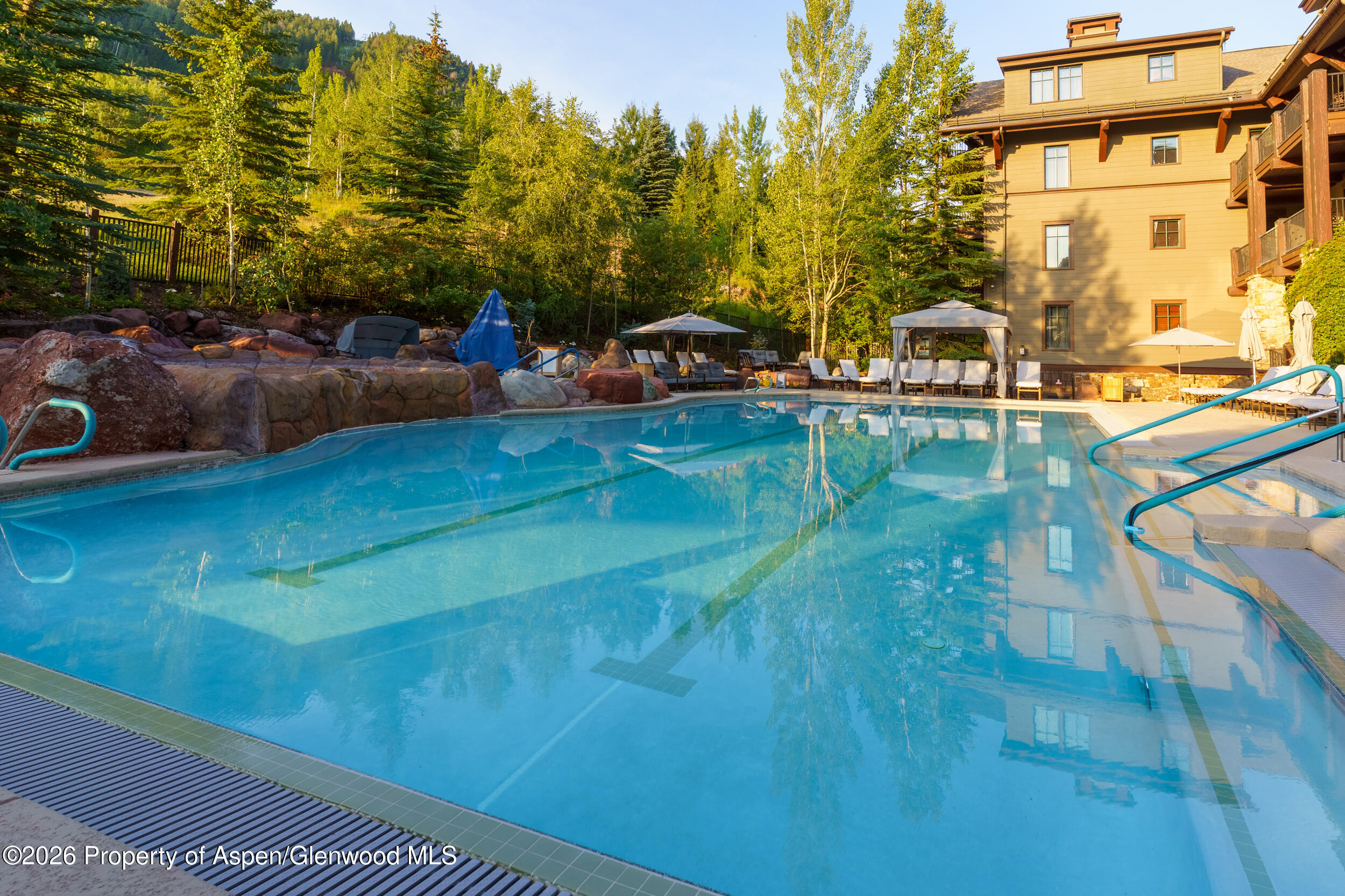 39 Boomerang Road, Unit 8210/WINTER INTEREST 3 Aspen, CO 81611 - Photo 28 of 44 a view of a swimming pool with a patio