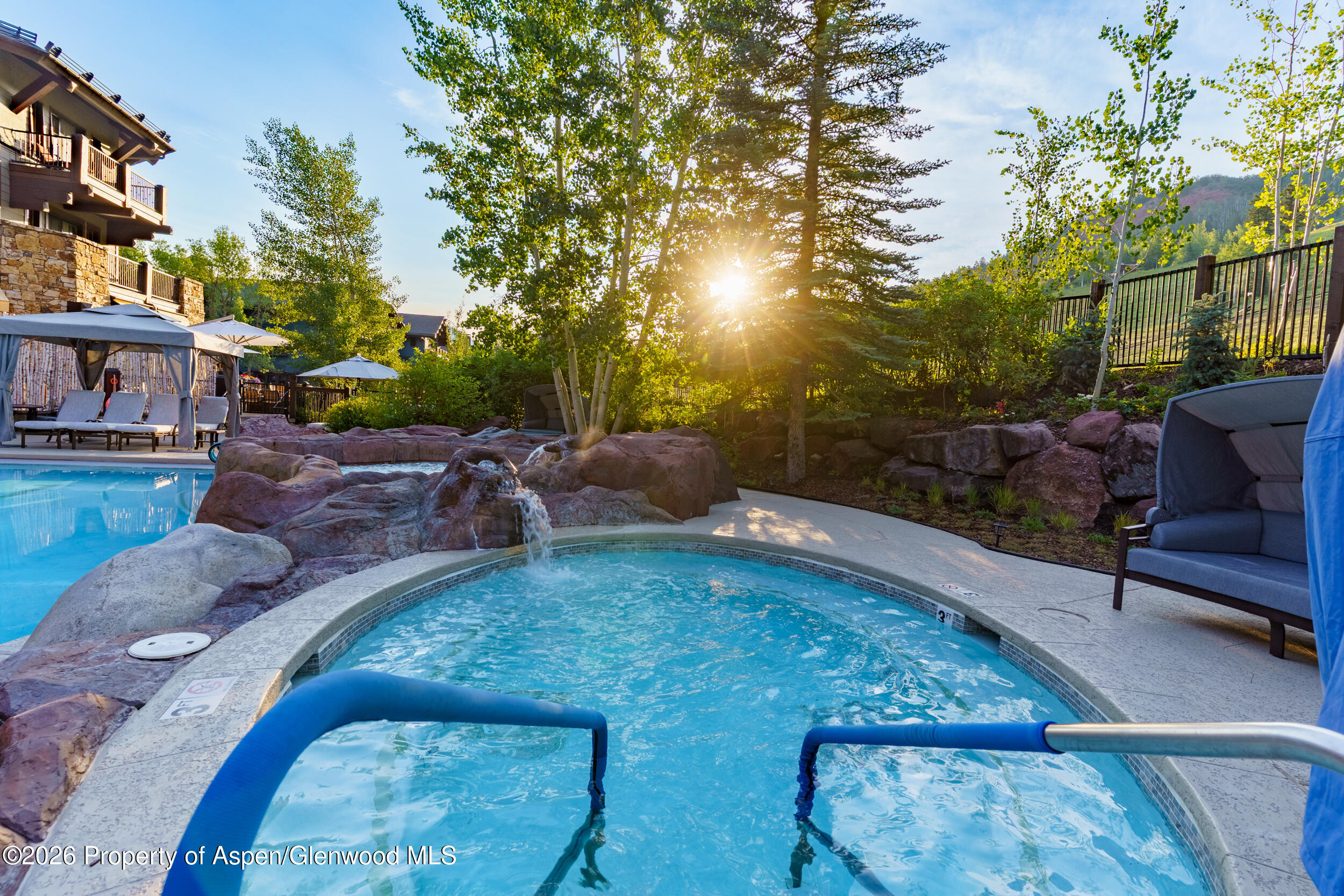 39 Boomerang Road, Unit 8210/WINTER INTEREST 3 Aspen, CO 81611 - Photo 30 of 44 a view of a backyard with sitting area