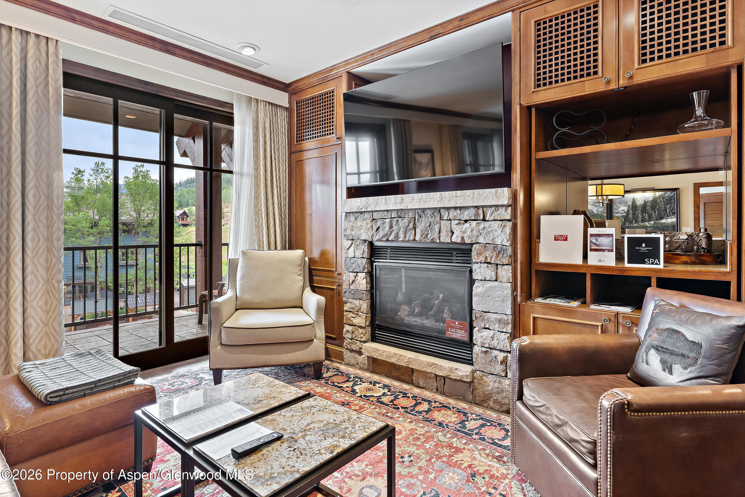 39 Boomerang Road, Unit 8210/WINTER INTEREST 3 Aspen, CO 81611 - Photo 3 of 44 a living room with furniture a window and a fireplace