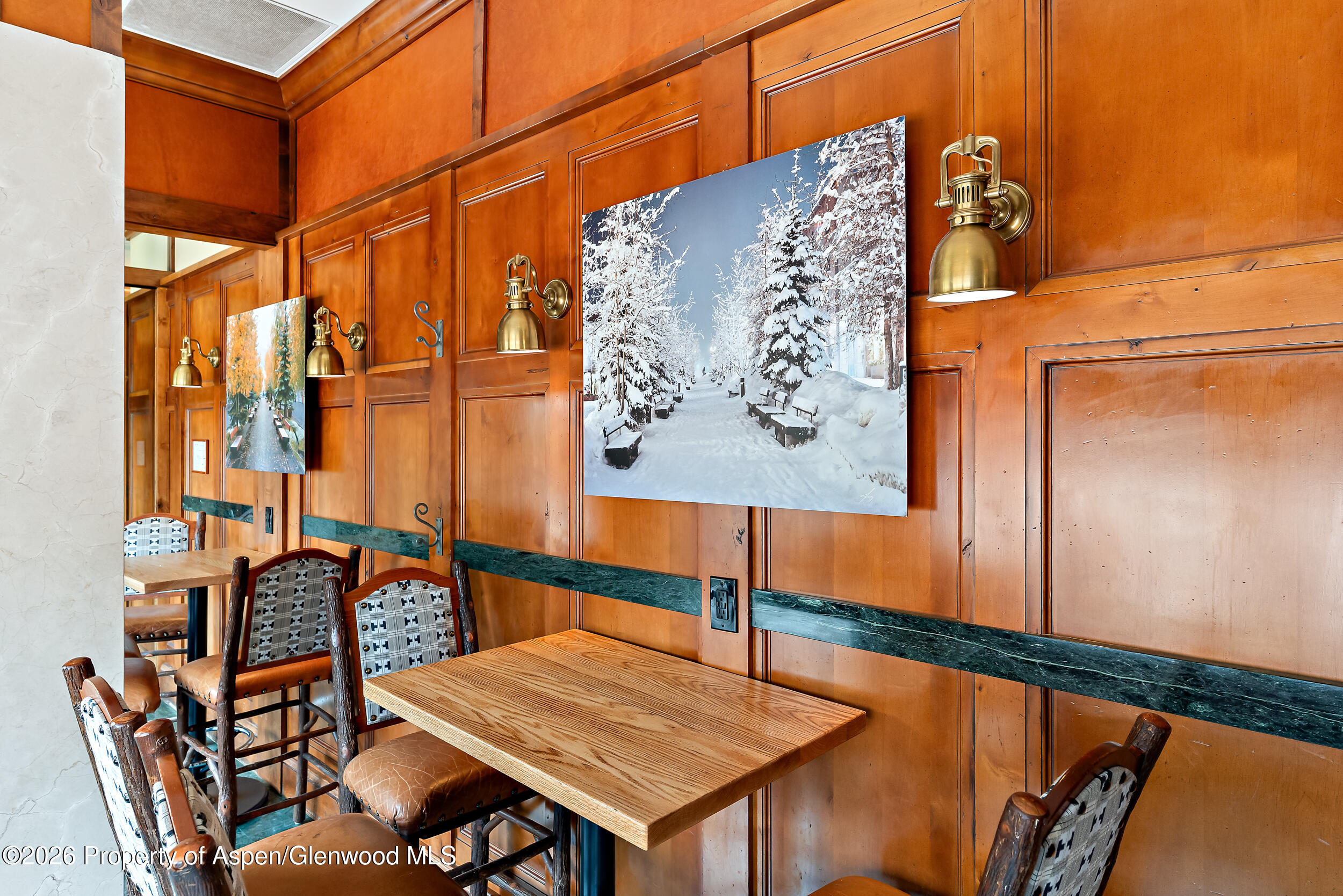 39 Boomerang Road, Unit 8210/WINTER INTEREST 3 Aspen, CO 81611 - Photo 38 of 44 a view of a chairs and table in the back of a building