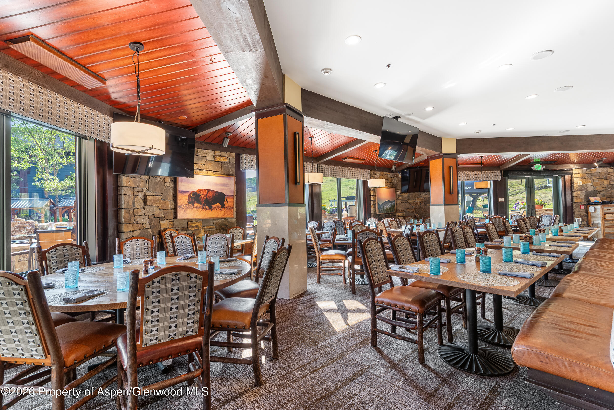 39 Boomerang Road, Unit 8210/WINTER INTEREST 3 Aspen, CO 81611 - Photo 44 of 44 a view of a patio with dining table and chairs