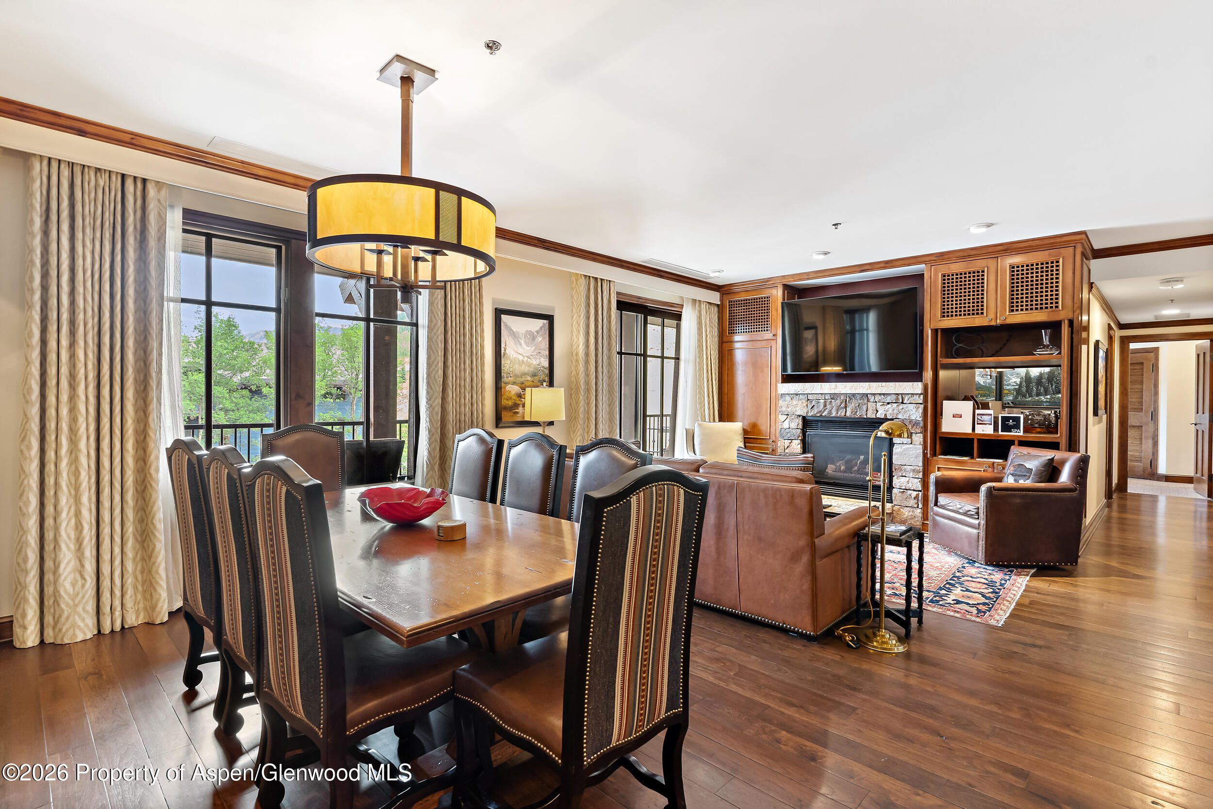 39 Boomerang Road, Unit 8210/WINTER INTEREST 3 Aspen, CO 81611 - Photo 6 of 44 a view of a dining room with furniture window and wooden floor