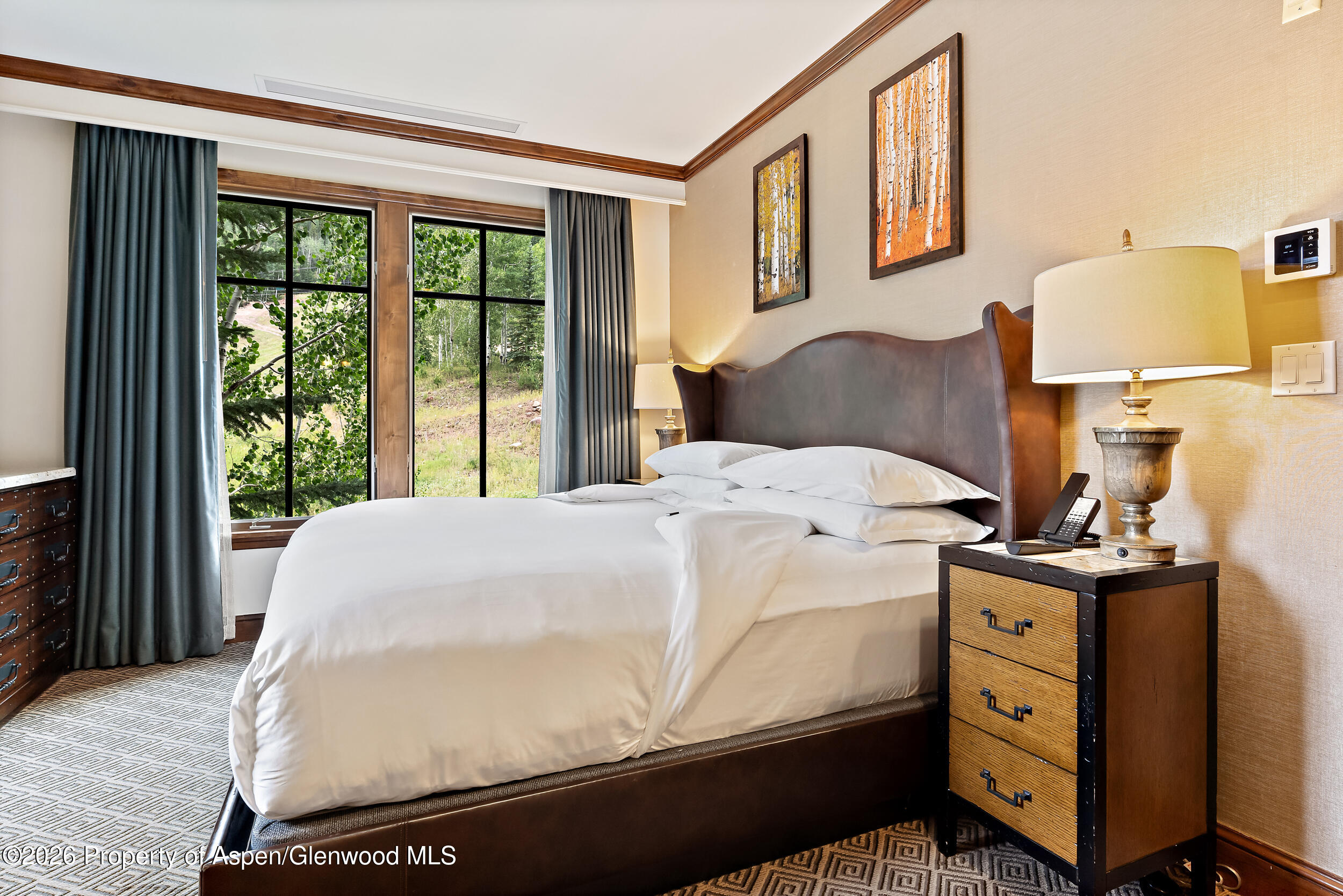 39 Boomerang Road, Unit 8210/WINTER INTEREST 3 Aspen, CO 81611 - Photo 10 of 44 a bedroom with a bed and wooden floor