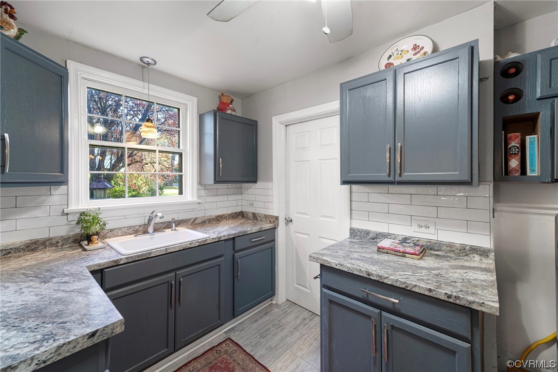 1018 Ridge Top Road Henrico, VA 23229 - Photo 20 of 33 a kitchen with granite countertop stainless steel appliances sink stove and cabinets