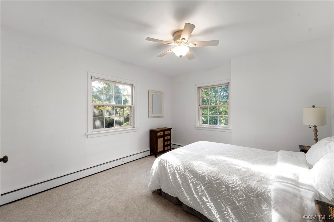 1018 Ridge Top Road Henrico, VA 23229 - Photo 23 of 33 a bedroom with a large bed and a window