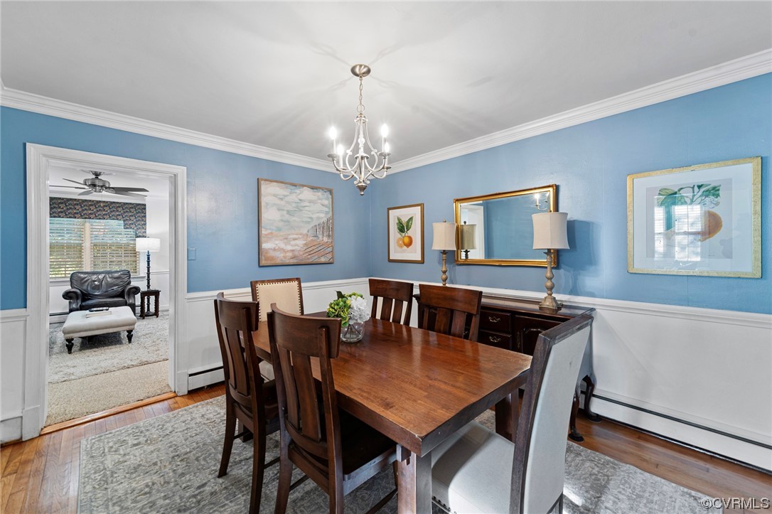 1018 Ridge Top Road Henrico, VA 23229 - Photo 7 of 33 a view of a dining room with furniture and a chandelier