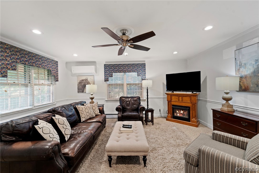 1018 Ridge Top Road Henrico, VA 23229 - Photo 9 of 33 a living room with furniture a flat screen tv and a fireplace