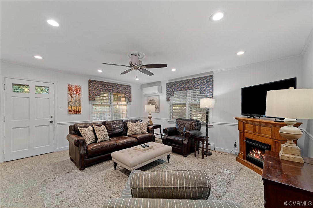 1018 Ridge Top Road Henrico, VA 23229 - Photo 10 of 33 a living room with furniture and a flat screen tv