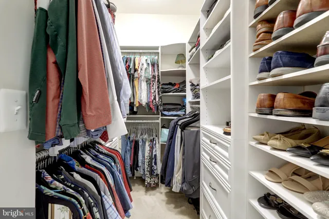 a kitchen with white cabinets and a sink
