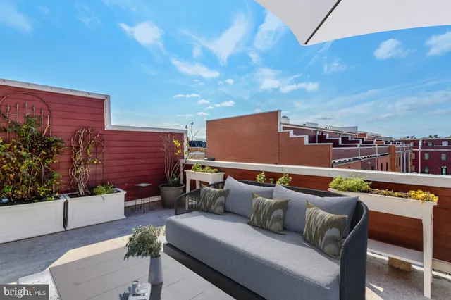 a bedroom with a bed and flat screen tv