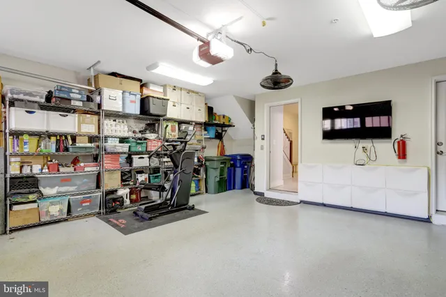a view of a patio with table and chairs