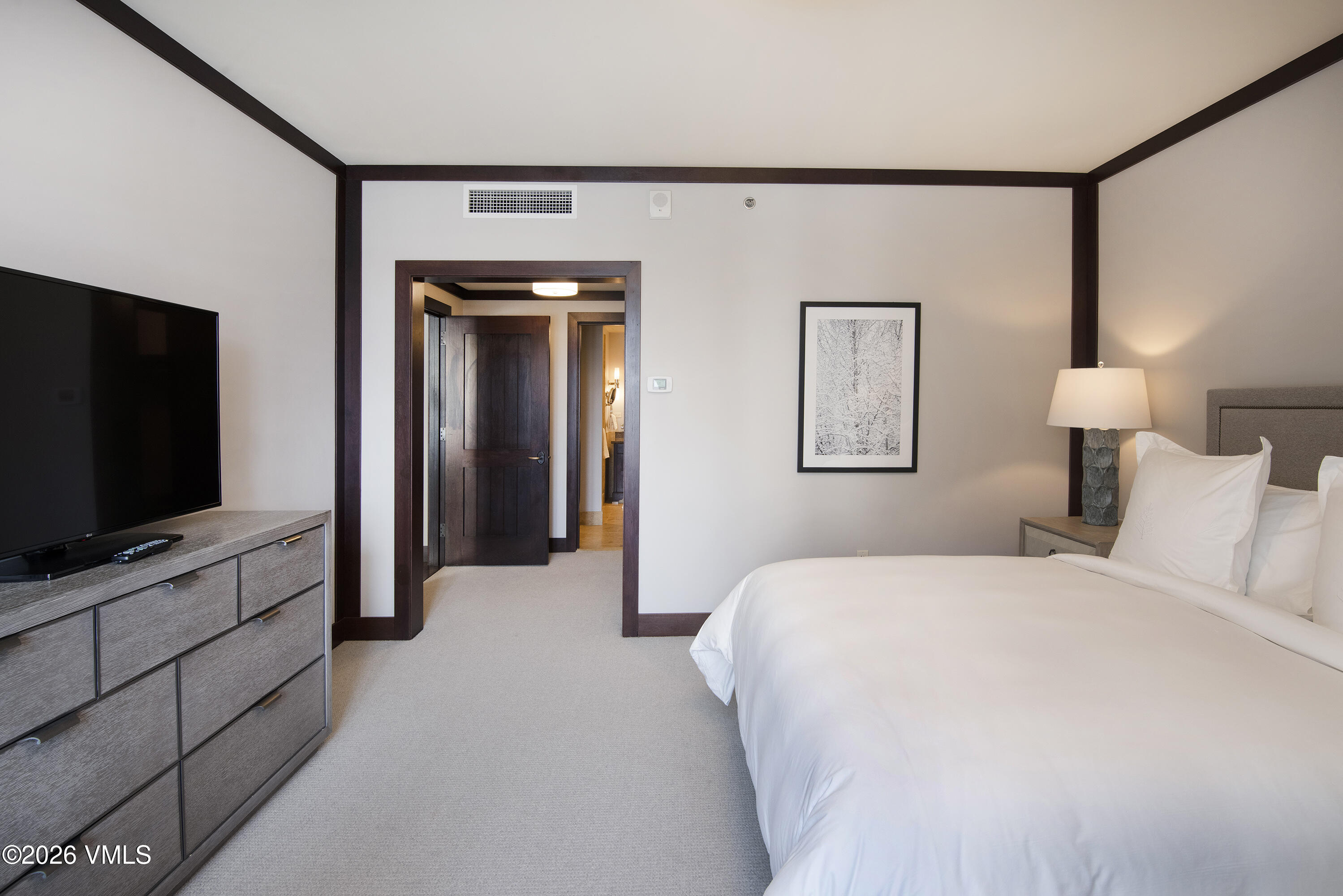 1 Vail Road, Unit 7105F Vail, CO 81657 - Photo 14 of 25 a bedroom with a bed and a flat screen tv