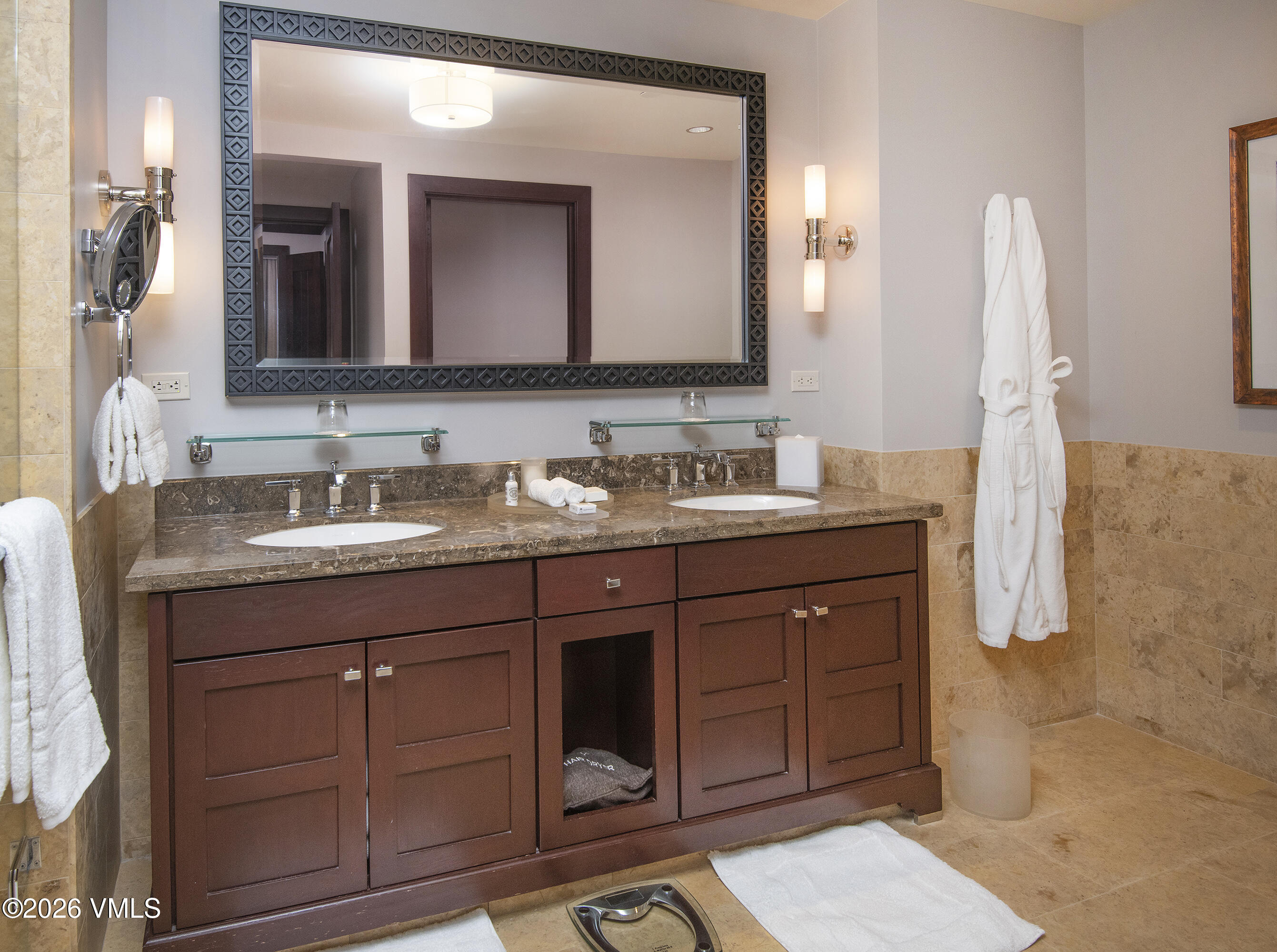 1 Vail Road, Unit 7105F Vail, CO 81657 - Photo 15 of 25 a bathroom with a double vanity sink and mirror