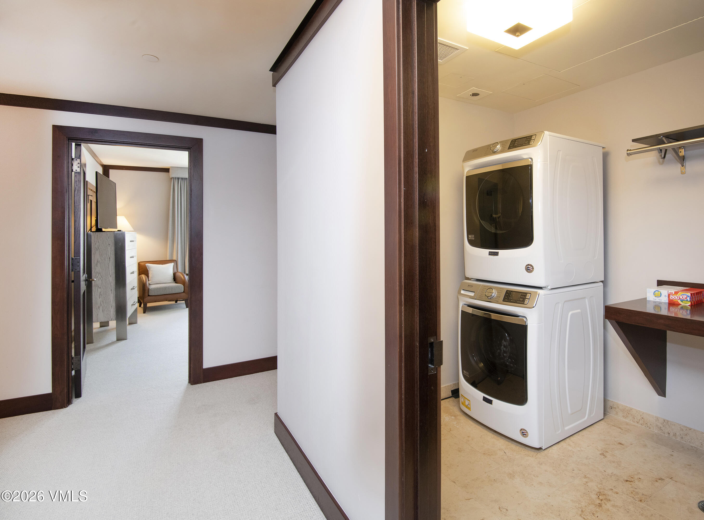 1 Vail Road, Unit 7105F Vail, CO 81657 - Photo 21 of 25 a view of a hallway with washer and dryer