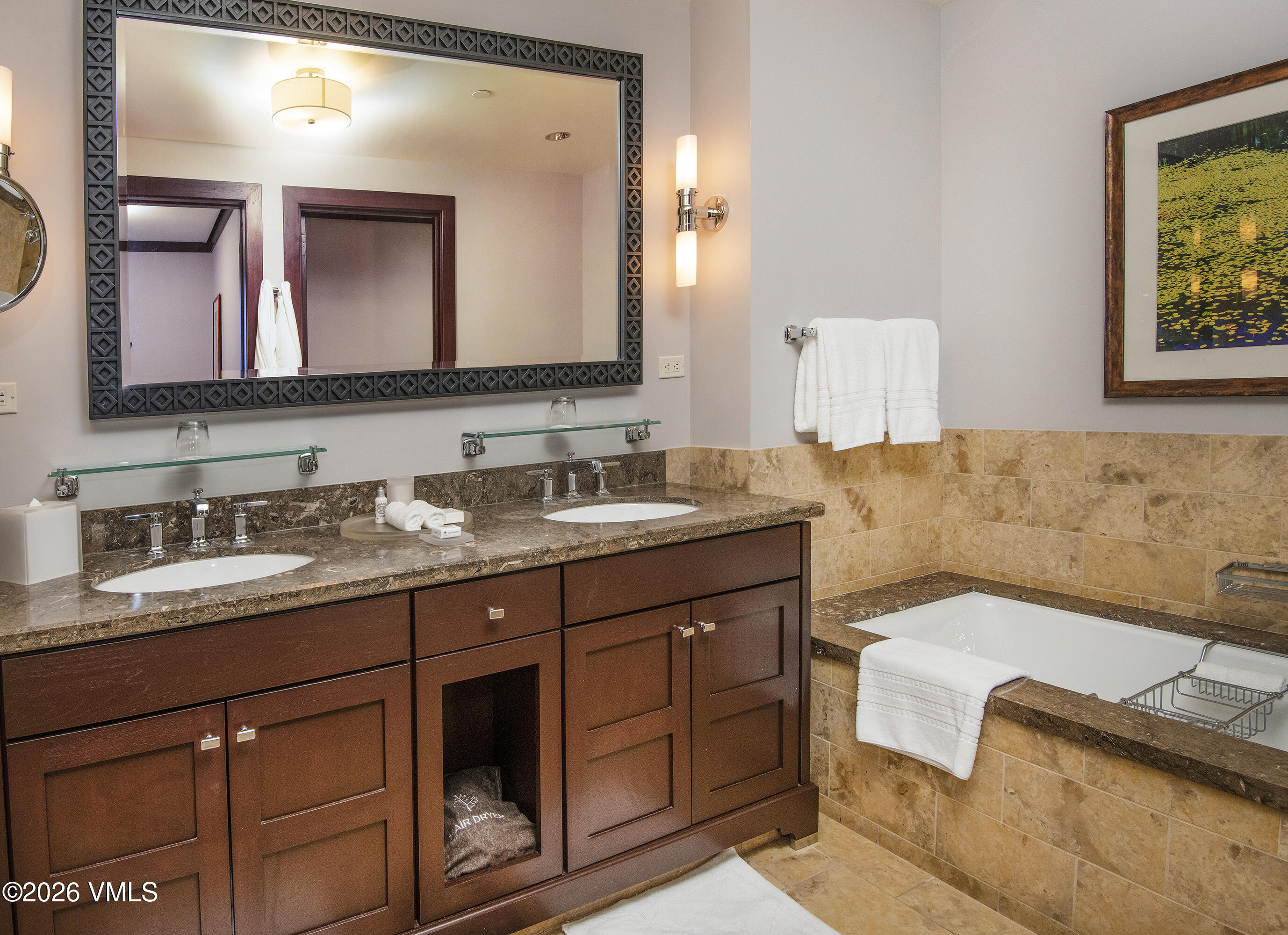 1 Vail Road, Unit 7105F Vail, CO 81657 - Photo 24 of 25 a en suite bathroom with a granite countertop sink and a mirror