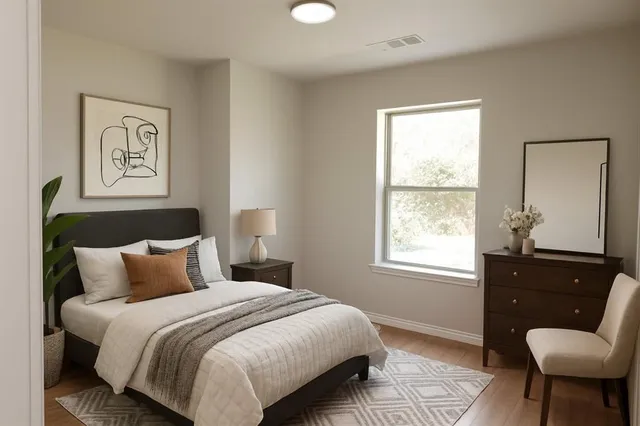 a bedroom with a bed and window