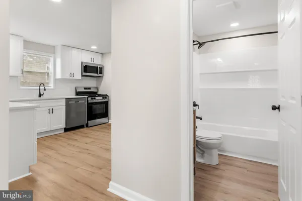 a bathroom with a toilet a sink and a bathtub