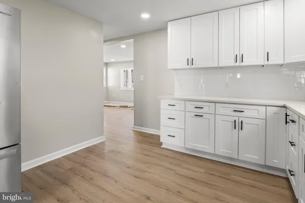 a view of cabinets and wooden floor