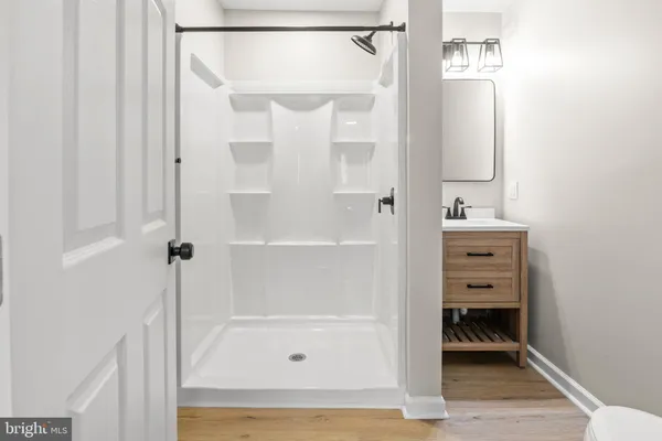 a bathroom with a bathtub and a shower