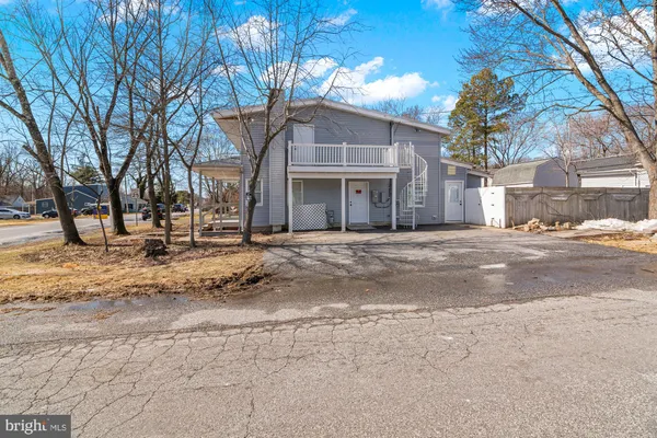 a view of road with large house