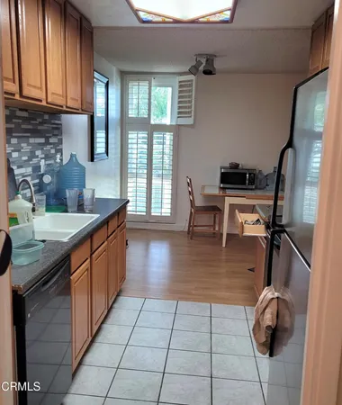 a kitchen with sink cabinets and outdoor seating