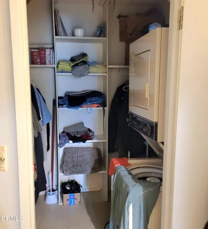 a bedroom with a bunk bed and a chair