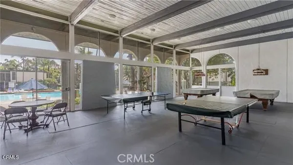 a living room with furniture a window and a table