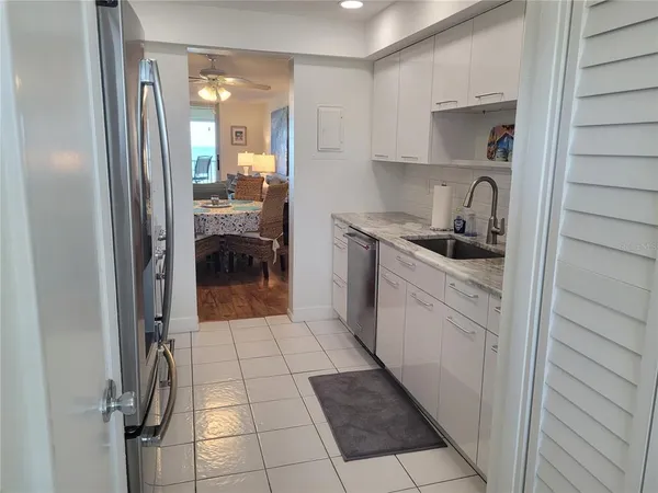 a kitchen with a sink and cabinets