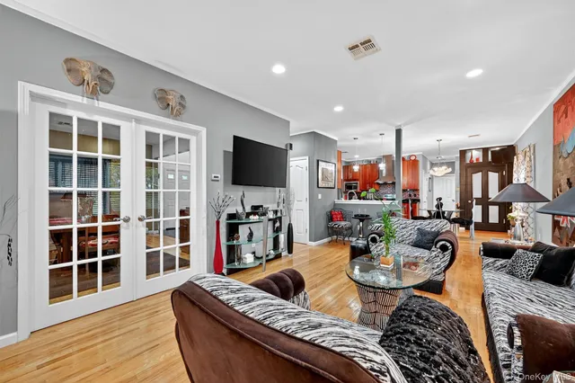 a living room with fireplace furniture and a flat screen tv