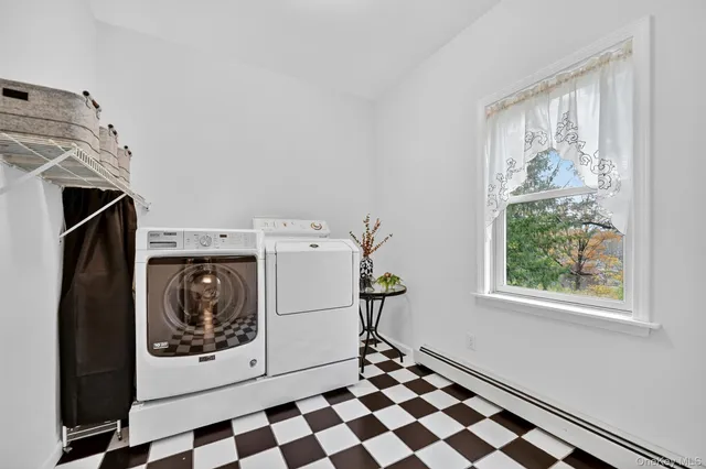 a utility room with a window dryer and washer