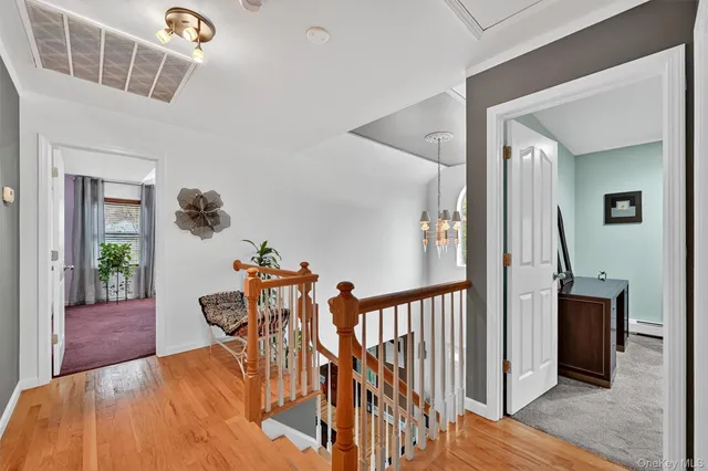 a view of a livingroom with furniture and stairs