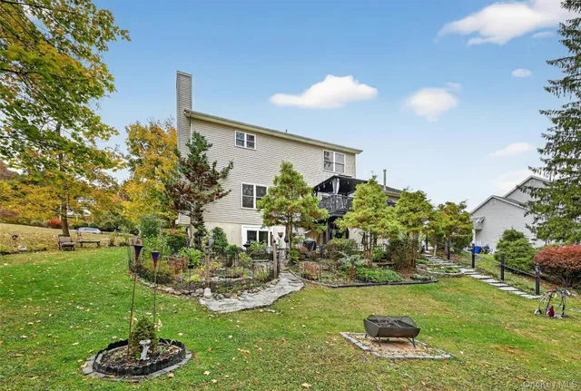a view of a backyard with plants and a patio