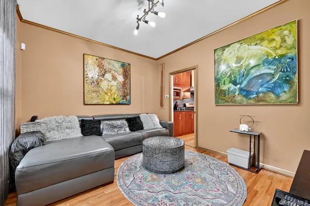 a living room with furniture and a painting