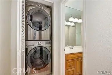 a view of a hallway with washer and dryer
